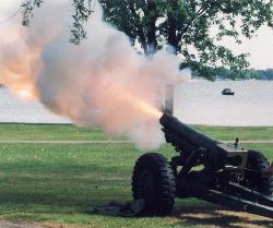 Near the lakeshore, the howitzer fires to announce "Retreat."